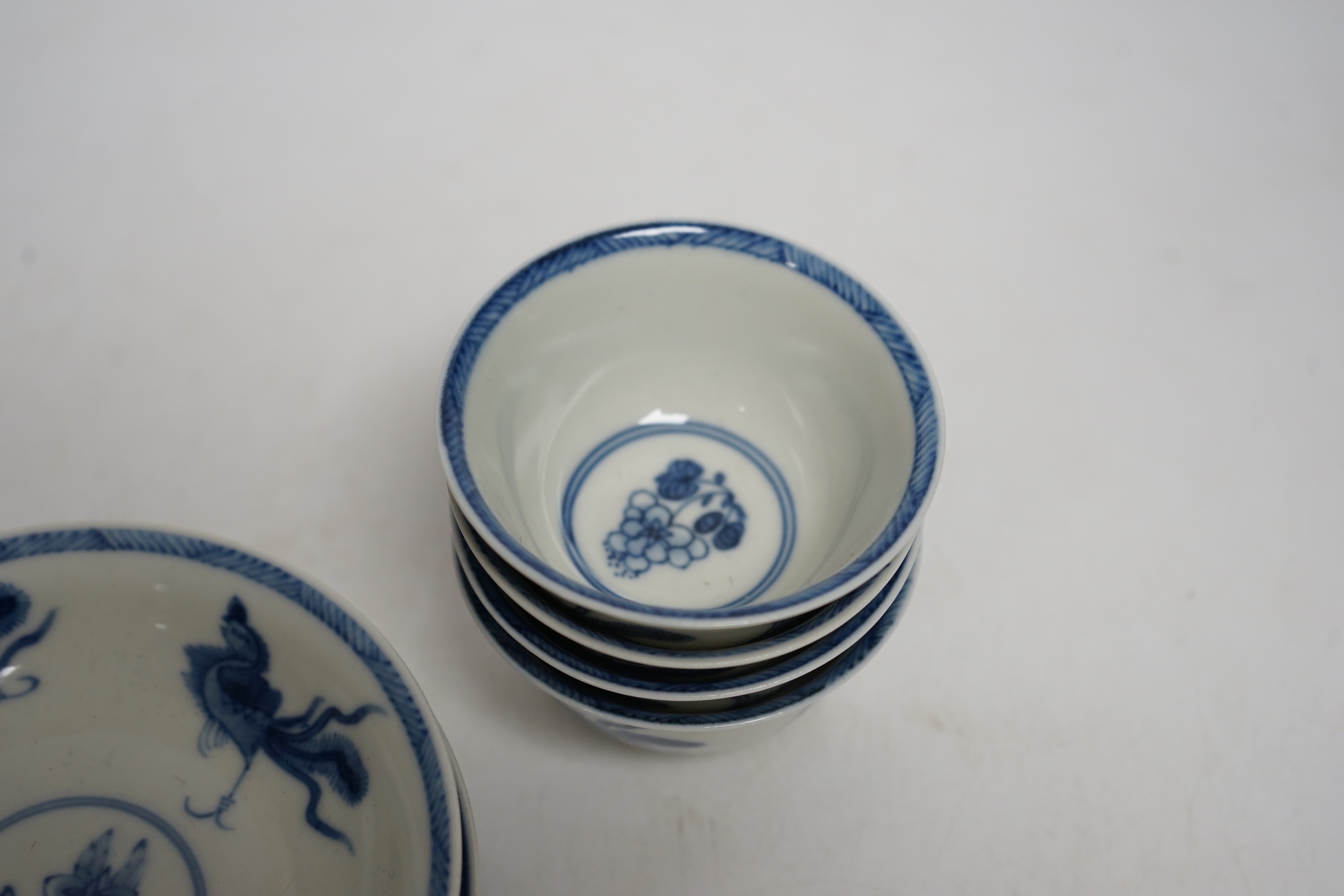 A set of four Chinese blue and white teabowls and saucers